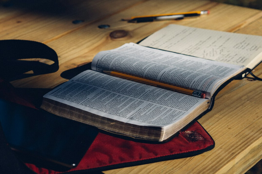 Open notebook and pen on a desk for reporting notes