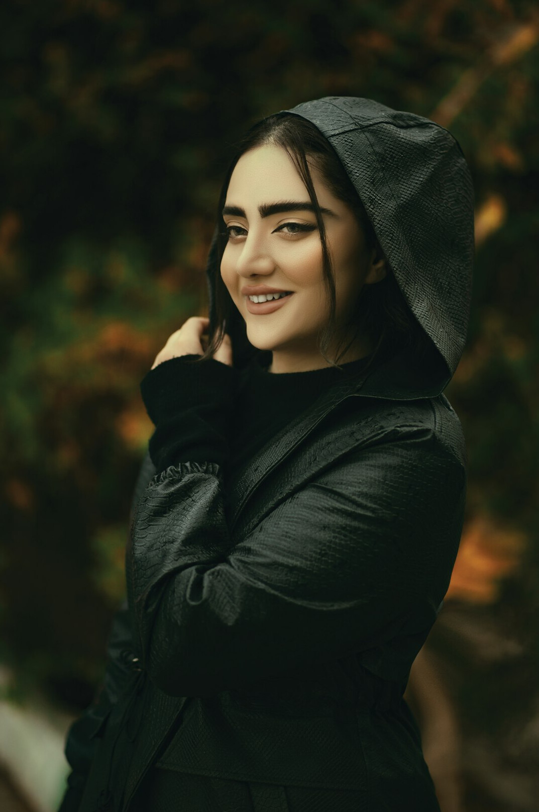 Portrait of a smiling Turkish woman in a dark jacket